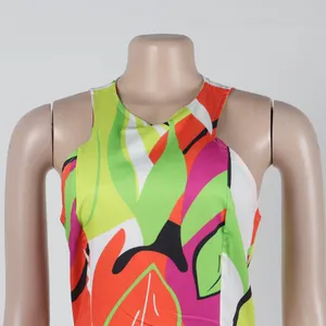 Detail view showing the vibrant abstract pattern on a sleeveless halter neck bodycon dress.