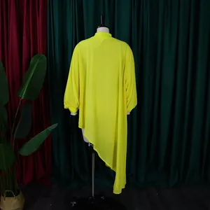 Back view of a vibrant yellow irregular hem chiffon plus size dress displayed on a mannequin