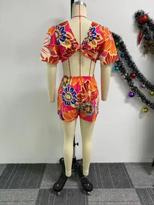 Back view detail of floral print romper with cutout tie-back and ruffle sleeves design