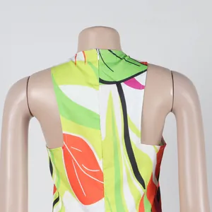 Back detail view of a tropical leaf print sleeveless dress with a hidden zipper.