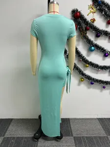 Back view of a sexy mint green slim fit midi dress with high slit and tie detail