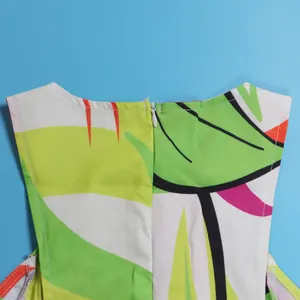 Macro detail of the back zipper closure on a colorful tropical leaf print sleeveless dress