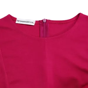 Detailed view of magenta dress neckline with brand tag and back zipper closure
