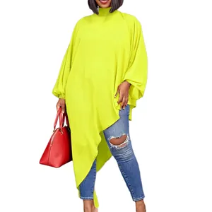 Detail view of lime green asymmetrical chiffon tunic with lantern sleeves and high neck