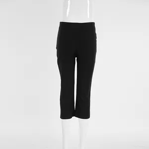 Detailed front view of women's slim-fit black high-waisted cropped yoga pants on mannequin.
