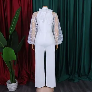 Back view of white elegant jumpsuit with lace mesh lantern sleeves on standing mannequin