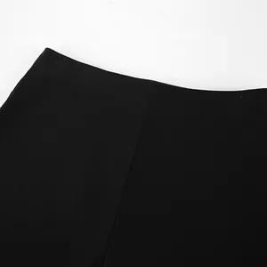 Close-up of the high-waisted design and smooth fabric on black stretchy yoga pants