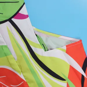 Close-up detail showing the high-quality stitching and vibrant floral print of the dress.