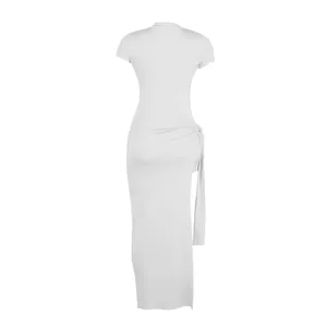 Detailed back view of a sexy white bodycon maxi dress with side slit and tie detail