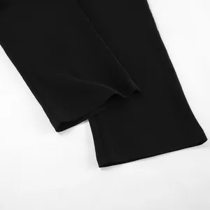 Detailed close-up view showing the flat hem and premium fabric of black cropped yoga pants
