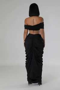 Back view of sexy black off-shoulder ruched maxi skirt and crop top two-piece set
