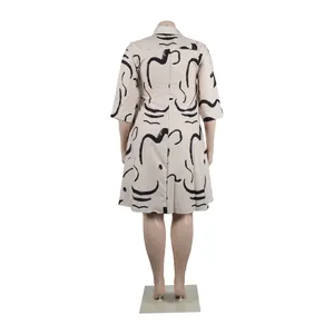 Rear view detail of a plus-size short sleeve lapel dress with abstract black line prints