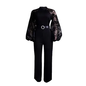 Elegant black wide leg jumpsuit featuring sheer floral puff sleeves and rhinestone belt.