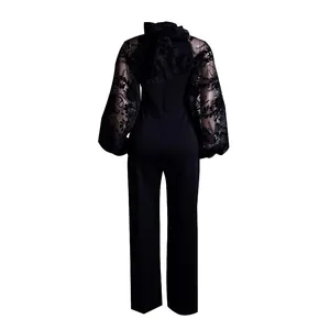 Back view of black stand collar jumpsuit with mesh lace lantern sleeves