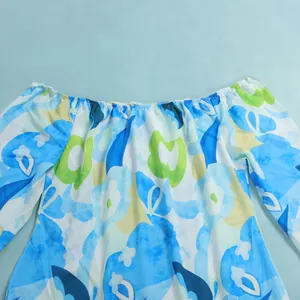 Close-up view showing the elastic off-the-shoulder neckline on this floral dress.