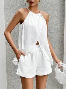 Detail view of the elegant white halter neck two-piece set with a stylish front slit top.