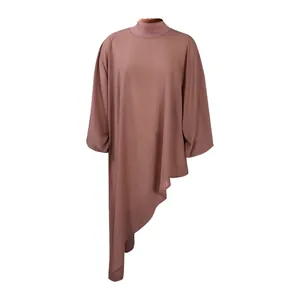 Detail showing the unique asymmetric hemline and loose chiffon fabric of the dress
