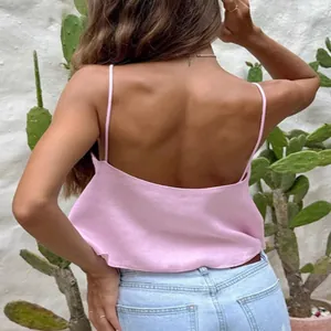 Back view of a sexy pink linen camisole crop top for summer street style fashion