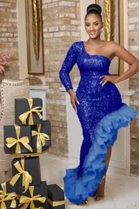 Royal blue sequined one-shoulder evening dress with a dramatic ruffled tulle mermaid hem.