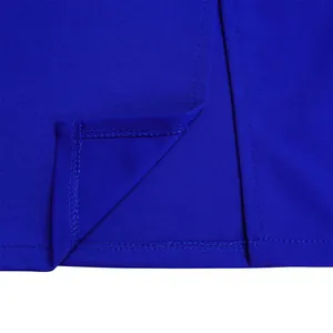 Close-up detail of high-quality stitching and hem on elegant royal blue dress