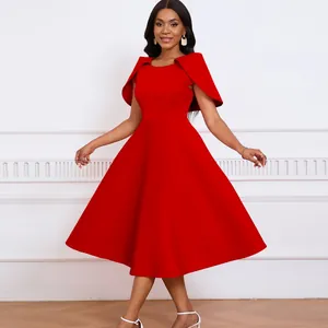 Elegant red party dress featuring a unique cape sleeve design and a wide flared hem