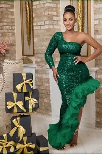 Model wearing an elegant green sequin one-shoulder evening dress with ruffled mesh hem