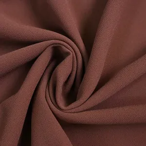 Macro view of dark brown chiffon fabric showing a fine and breathable texture detail