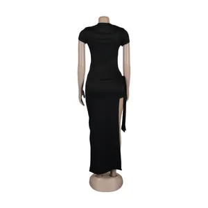 Back view of a sexy black two-piece midi dress with a high side slit and tie detail