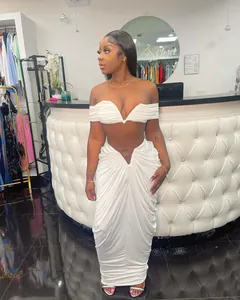 Elegant white two-piece pleated maxi set with off-the-shoulder crop top and long skirt