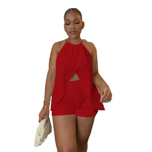 Front view of a red two-piece halter neck set with crossover top and shorts.