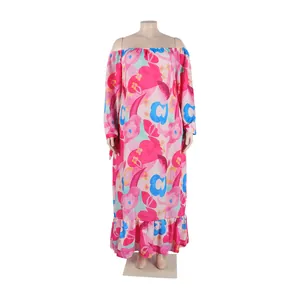 Detail view of a vibrant floral print off-the-shoulder maxi dress with ruffle hem.