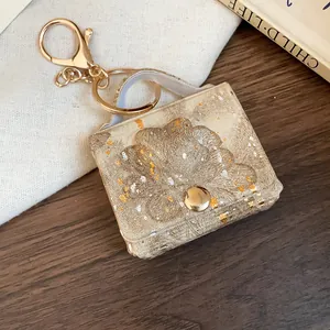Elegante portachiavi a mini borsa con stampa oro e argento su pelle martellata fine