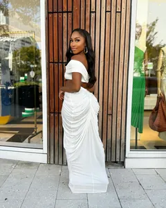 Detailed view of the white ruched two-piece set featuring an off-shoulder crop top