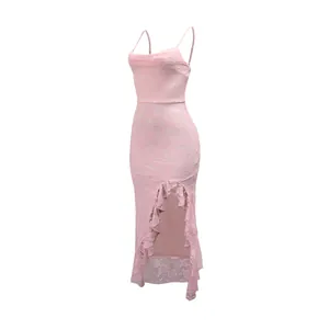 Detailed macro view of elegant pink lace dress featuring ruffle trim and high side slit.