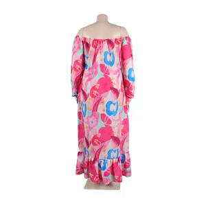 Back view of an off-the-shoulder floral maxi dress with vibrant pink and blue patterns