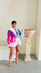 Sexy white blazer and shorts set with vibrant purple and blue floral print details