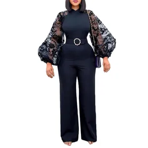 Elegant black wide-leg jumpsuit with sheer floral mesh lantern sleeves and belt.