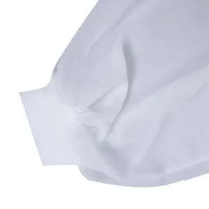 Close-up detail of white chiffon dress sleeve featuring a ribbed elasticated cuff