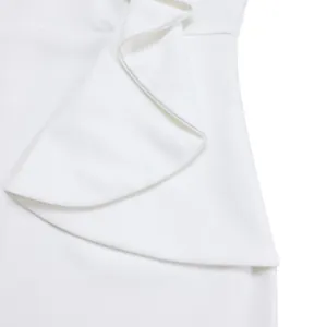 Detailed close-up view of the elegant ruffle design on a white stylish fashion dress