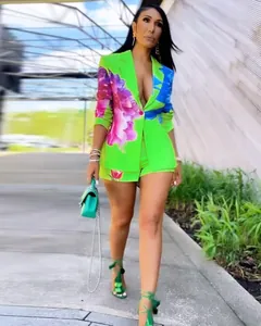 Sexy two-piece green blazer and shorts set with vibrant floral print and deep neckline