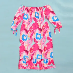 Floral print off-the-shoulder long sleeve dress with ruffled hem and tie-cuffs