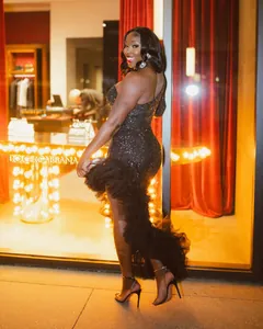 Elegant black one-shoulder sequined dress featuring a dramatic ruffled asymmetric mesh hem