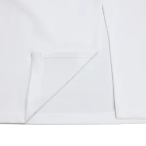 Close-up detail of clean white fabric stitching and hem finish on a modern elegant dress