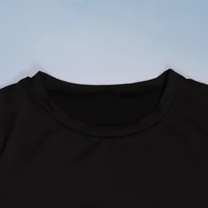 Detailed macro view of the crew neck collar on a high-quality black elastic bodycon dress