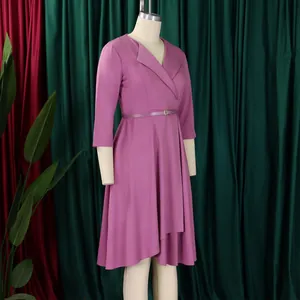 Detailed view of a mauve V-neck midi dress with waist belt displayed on a mannequin.
