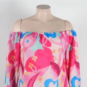 Close-up detail of sexy off-the-shoulder dress featuring vibrant floral print design