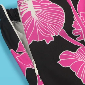 Detailed macro view showing the high-quality invisible side zipper on a floral print romper skirt
