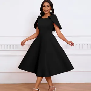 Elegant black evening party dress featuring unique capelet sleeves and flared A-line skirt.