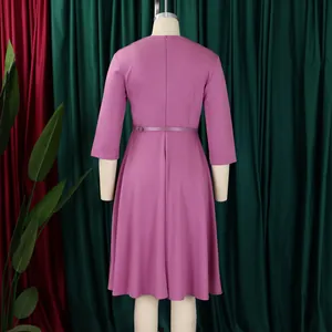 Detailed back view of a mauve high-waist A-line dress with 3/4 sleeves and thin belt