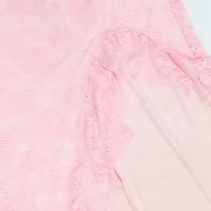 Detail of pink floral lace fabric with ruffle edge and slit design for sexy dress